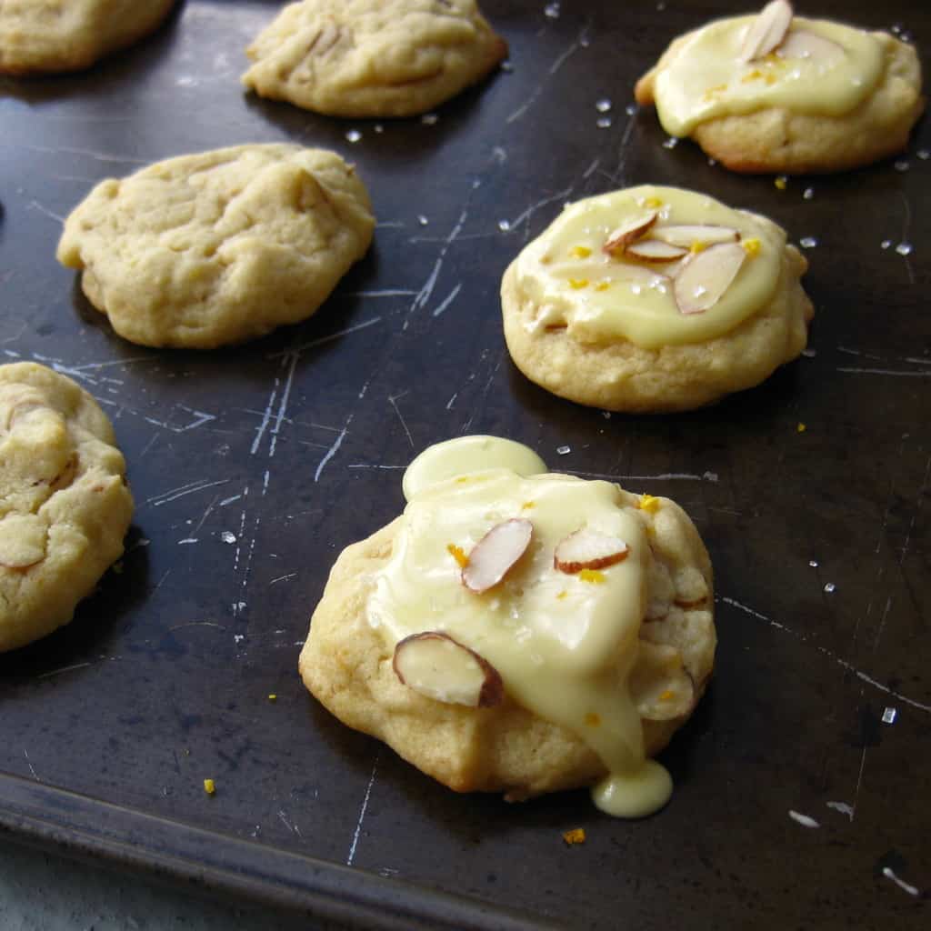 vegan orange almond cookies on dark baking sheet