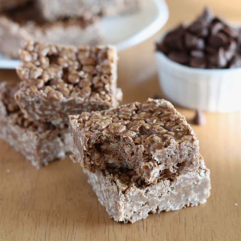 carob peanut butter rice krispy treats cut into squares with wooden background