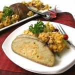 Vegan turkey roast with vegan stuffing on white plate